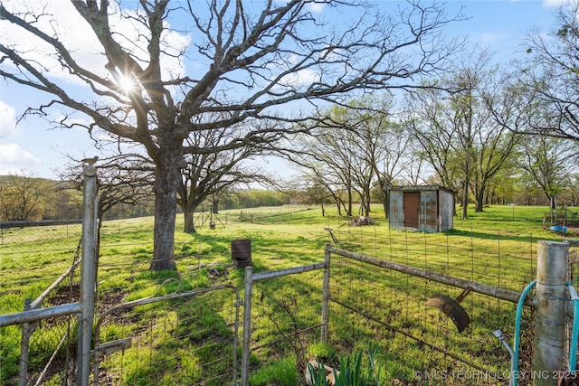 14531 S 107th W Ave, Sapulpa, OK 74066 - view of yard with a rural view, a storage unit, fence, and an outdoor structure