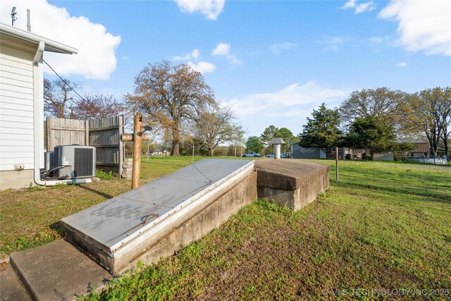 14531 S 107th W Ave, Sapulpa, OK 74066 - entry to storm shelter featuring a yard, fence, and central AC