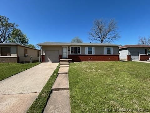 4435 W 1st St, Tulsa, OK 74127 - single story home with a garage, driveway, and a front lawn