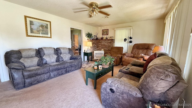 84936 S 4612th Rd, Stilwell, OK 74960 - living area featuring carpet flooring, ceiling fan, a textured ceiling, and healthy amount of natural light