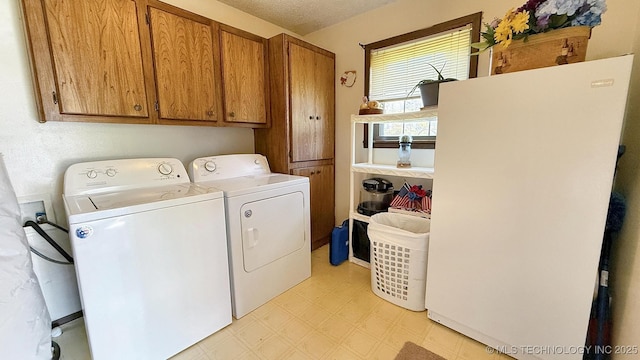 84936 S 4612th Rd, Stilwell, OK 74960 - washroom featuring cabinet space, washer and dryer, and light floors