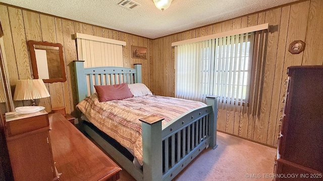 84936 S 4612th Rd, Stilwell, OK 74960 - carpeted bedroom with wood walls and a textured ceiling