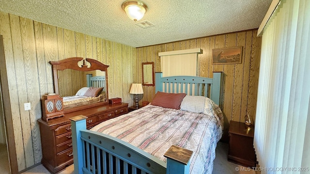 84936 S 4612th Rd, Stilwell, OK 74960 - bedroom featuring a textured ceiling and wooden walls