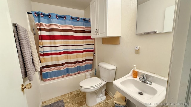 84936 S 4612th Rd, Stilwell, OK 74960 - bathroom featuring toilet, a sink, and shower / bath combination with curtain