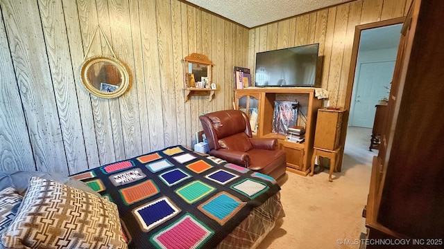 84936 S 4612th Rd, Stilwell, OK 74960 - bedroom featuring wooden walls, carpet floors, a textured ceiling, and ornamental molding