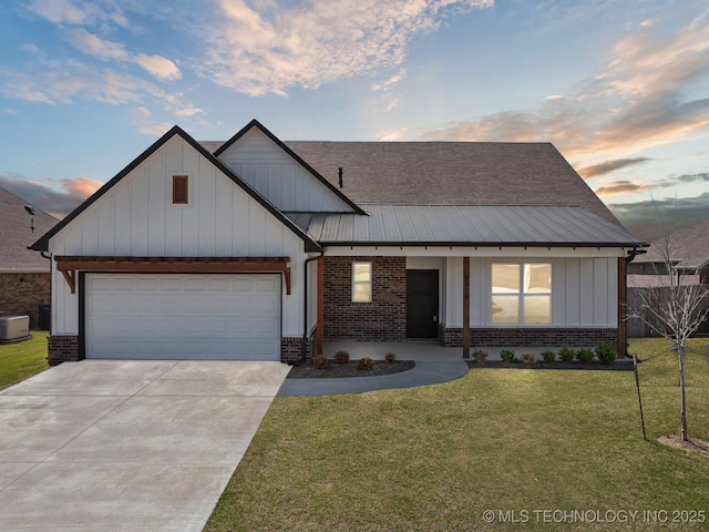 2916 S 8th St, Broken Arrow, OK 74012 - view of front facade with brick siding, concrete driveway, and board and batten siding