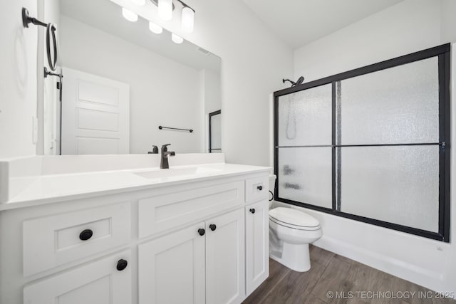 2916 S 8th St, Broken Arrow, OK 74012 - full bath featuring vanity, wood finished floors, and enclosed tub / shower combo