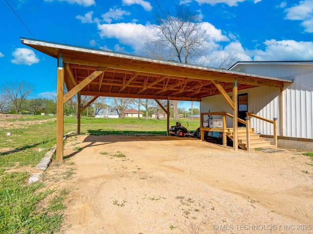 view of car parking with a carport and driveway