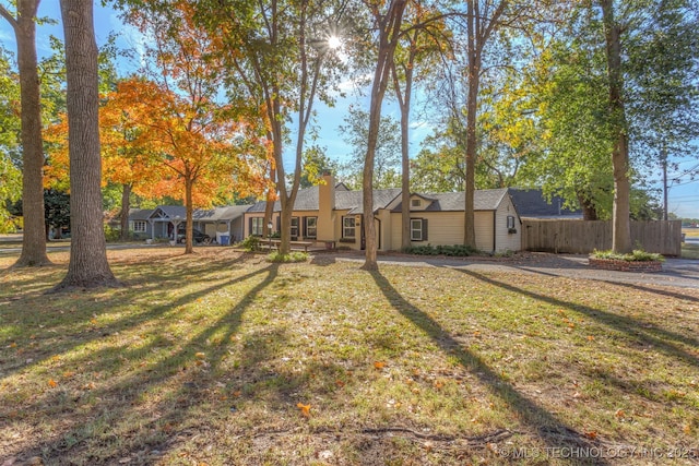3004 E 49th St, Tulsa, OK 74105 - view of front of home with a front yard and fence
