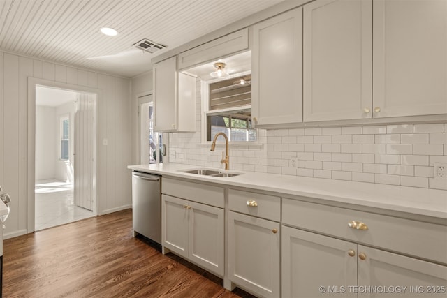 3004 E 49th St, Tulsa, OK 74105 - kitchen with visible vents, dishwasher, a sink, light countertops, and backsplash