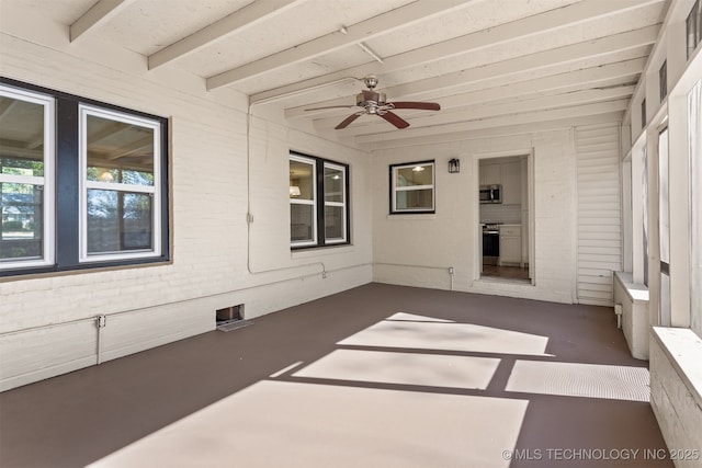 3004 E 49th St, Tulsa, OK 74105 - unfurnished sunroom featuring ceiling fan and beam ceiling