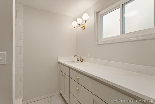 3004 E 49th St, Tulsa, OK 74105 - full bathroom featuring vanity, marble finish floor, and baseboards
