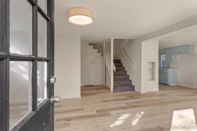 3004 E 49th St, Tulsa, OK 74105 - foyer featuring stairs and light wood-style flooring