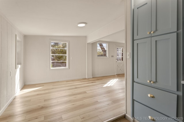 3004 E 49th St, Tulsa, OK 74105 - interior space with a decorative wall, light wood-style flooring, plenty of natural light, and baseboards