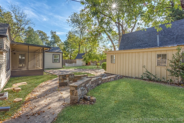 3004 E 49th St, Tulsa, OK 74105 - view of yard featuring a sunroom and fence