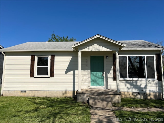 319 S Main St, Owasso, OK 74055 - bungalow-style house featuring crawl space, a shingled roof, and a front yard