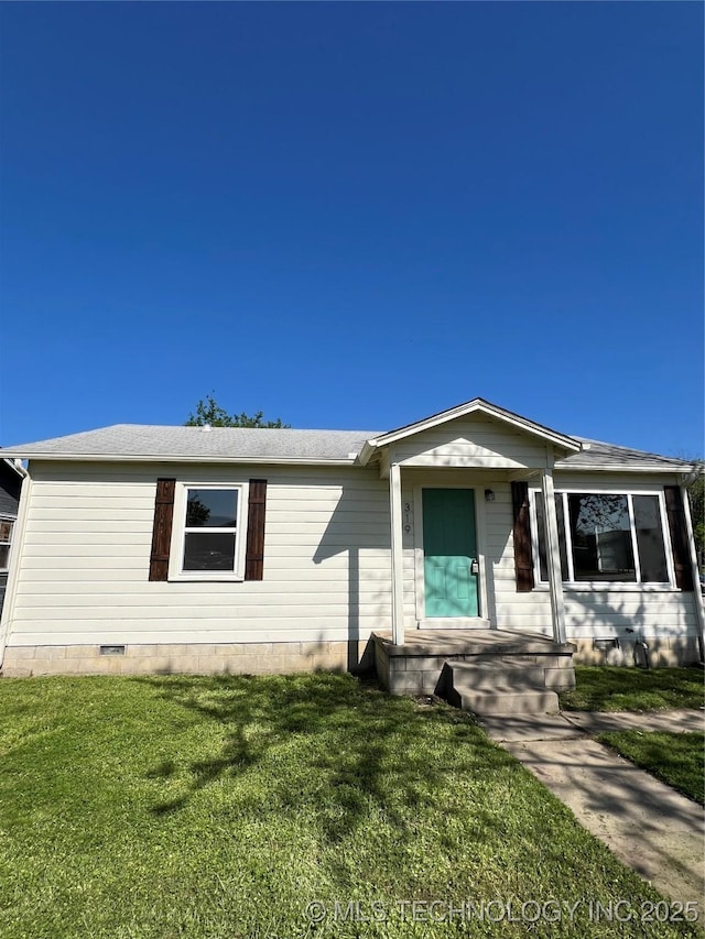 319 S Main St, Owasso, OK 74055 - view of front of house with a front lawn