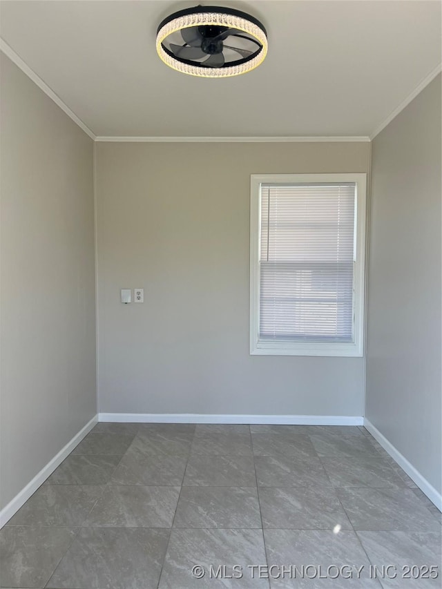 319 S Main St, Owasso, OK 74055 - spare room with ornamental molding and baseboards