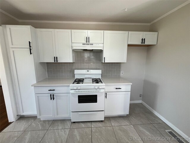 319 S Main St, Owasso, OK 74055 - kitchen featuring white gas stove, under cabinet range hood, visible vents, and light countertops