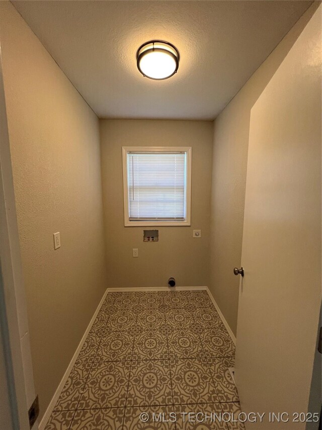 319 S Main St, Owasso, OK 74055 - laundry area with baseboards, laundry area, and washer hookup