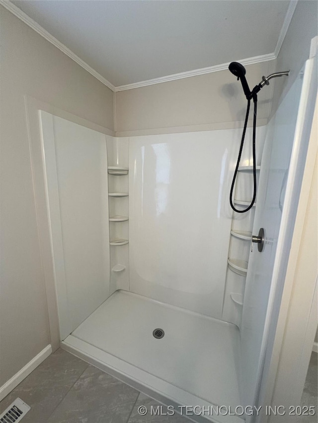 319 S Main St, Owasso, OK 74055 - bathroom featuring a shower, visible vents, baseboards, and ornamental molding