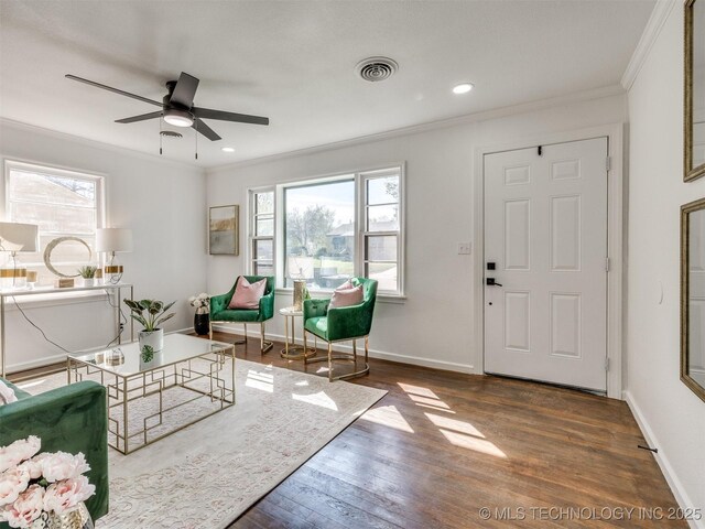 1809 N Delaware Pl, Tulsa, OK 74110 - living area featuring wood finished floors, ceiling fan, ornamental molding, and visible vents