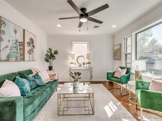 1809 N Delaware Pl, Tulsa, OK 74110 - living room with wood finished floors, ceiling fan, ornamental molding, and visible vents