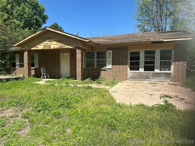 view of front of property featuring brick siding