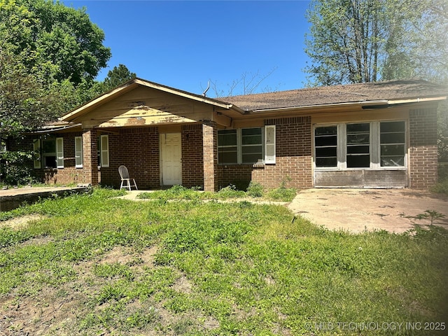 ranch-style home with brick siding