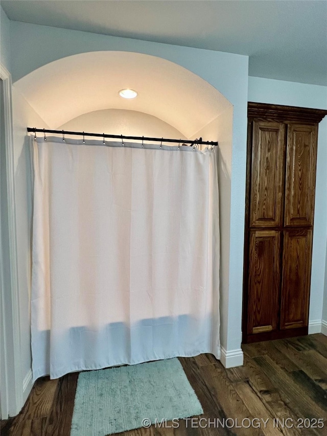 2516 Stage Coach Ave, Durant, OK 74701 - bathroom featuring baseboards and wood finished floors