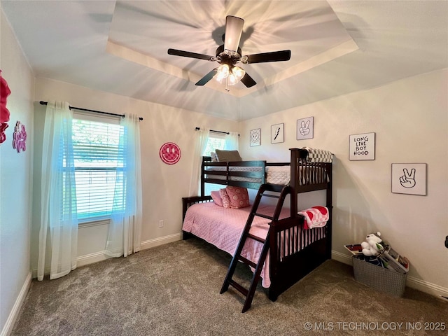 2516 Stage Coach Ave, Durant, OK 74701 - carpeted bedroom with a tray ceiling and baseboards