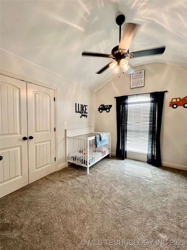 2516 Stage Coach Ave, Durant, OK 74701 - carpeted bedroom featuring a closet, baseboards, a nursery area, a ceiling fan, and vaulted ceiling