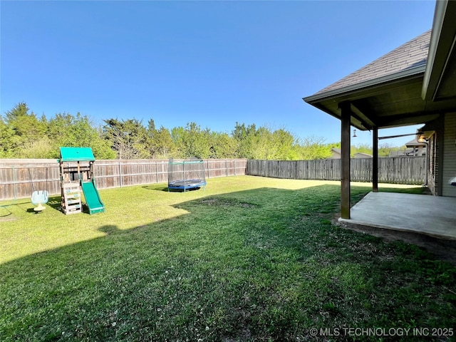 2516 Stage Coach Ave, Durant, OK 74701 - view of yard with a fenced backyard, a playground, and a patio