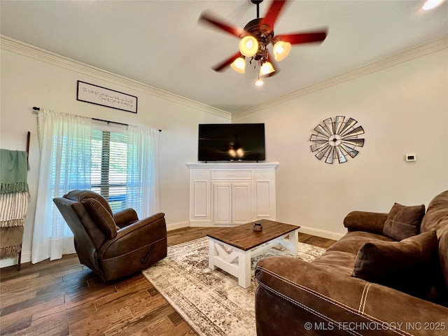 2516 Stage Coach Ave, Durant, OK 74701 - living room with crown molding, wood finished floors, ceiling fan, and baseboards