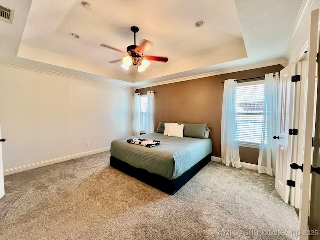 2516 Stage Coach Ave, Durant, OK 74701 - carpeted bedroom with visible vents, baseboards, crown molding, and a raised ceiling