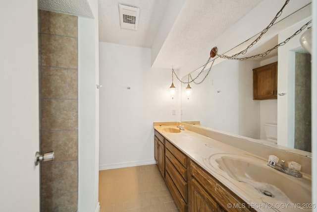 10785 E Dogwood Ct, Claremore, OK 74019 - full bath with a sink, visible vents, toilet, and double vanity