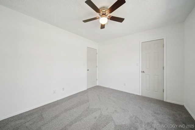 10785 E Dogwood Ct, Claremore, OK 74019 - spare room featuring a textured ceiling, ceiling fan, baseboards, and carpet
