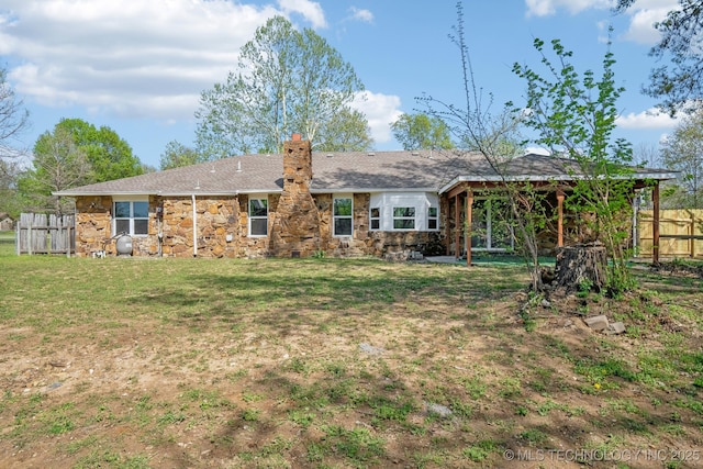 10785 E Dogwood Ct, Claremore, OK 74019 - back of property with a gazebo, fence, stone siding, and a lawn