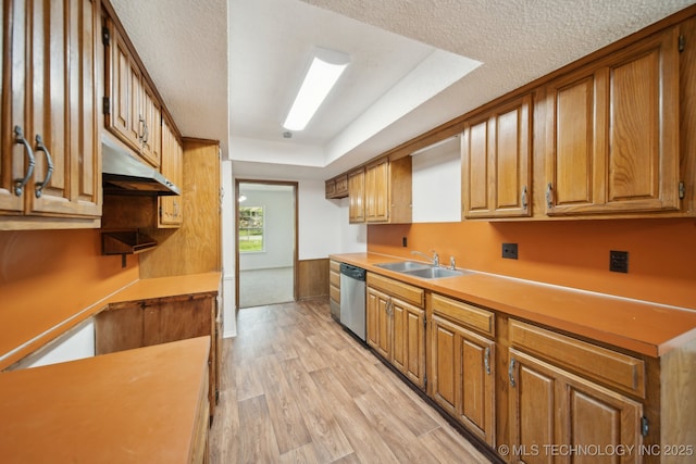 10785 E Dogwood Ct, Claremore, OK 74019 - kitchen with dishwasher, a sink, light countertops, brown cabinetry, and light wood-style flooring
