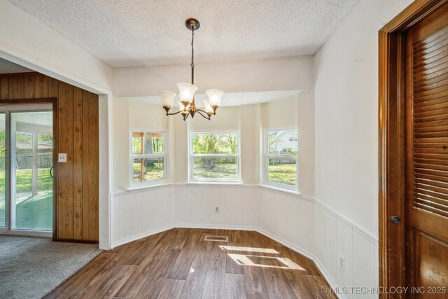10785 E Dogwood Ct, Claremore, OK 74019 - unfurnished dining area featuring visible vents, a wealth of natural light, and a textured ceiling