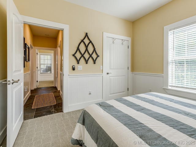 263 Eagles Nest Path, Stigler, OK 74462 - bedroom with wainscoting and tile patterned floors