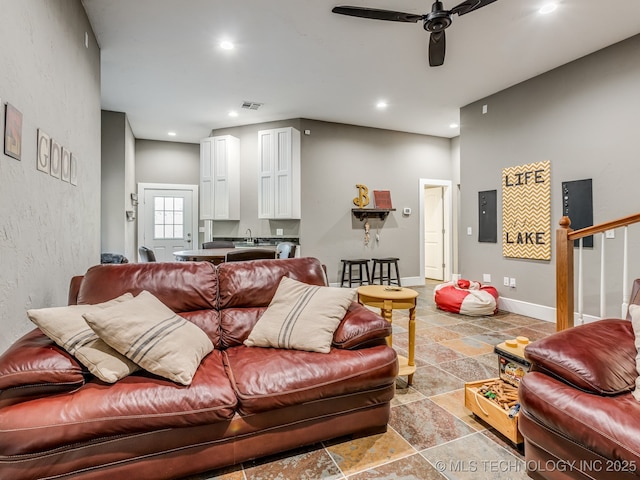 263 Eagles Nest Path, Stigler, OK 74462 - living area featuring stone tile floors, baseboards, visible vents, recessed lighting, and ceiling fan