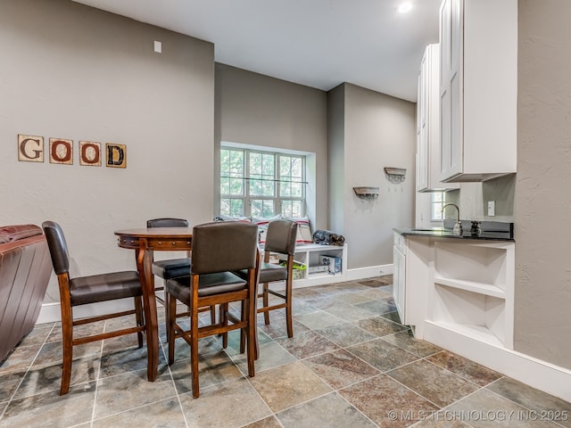 263 Eagles Nest Path, Stigler, OK 74462 - dining room with stone tile floors and baseboards