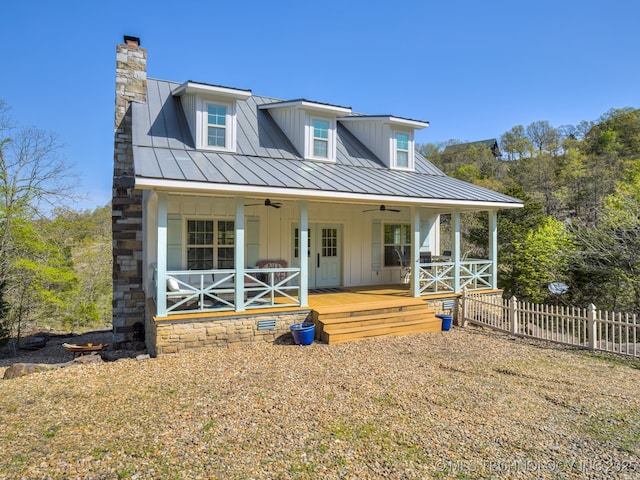 263 Eagles Nest Path, Stigler, OK 74462 - rear view of house with fence, board and batten siding, ceiling fan, a standing seam roof, and metal roof