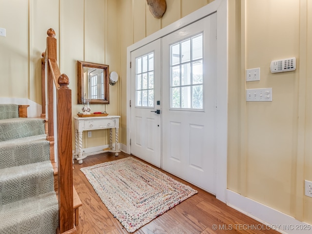263 Eagles Nest Path, Stigler, OK 74462 - foyer featuring baseboards, wood finished floors, and stairs