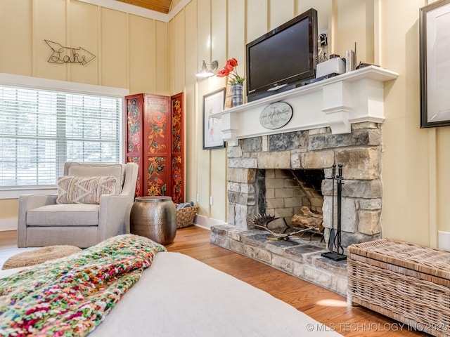 263 Eagles Nest Path, Stigler, OK 74462 - bedroom with baseboards, wood finished floors, and a fireplace