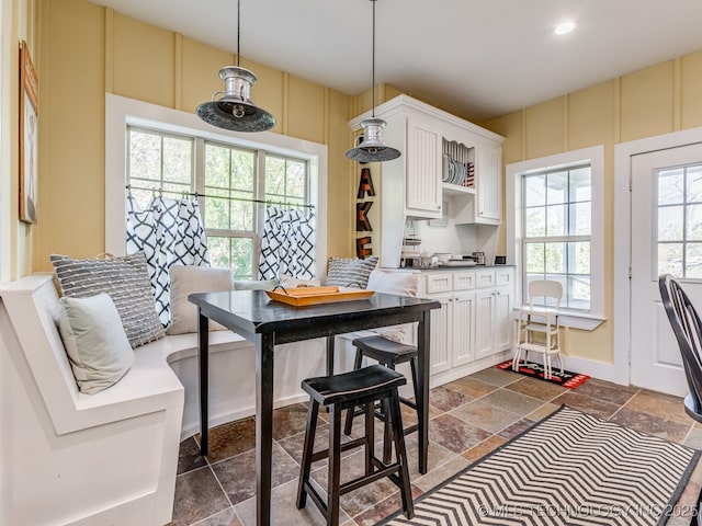 263 Eagles Nest Path, Stigler, OK 74462 - kitchen featuring recessed lighting, decorative light fixtures, stone tile floors, and white cabinetry