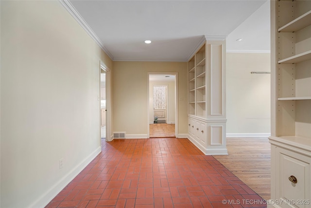 hallway with recessed lighting, brick floor, visible vents, and crown molding