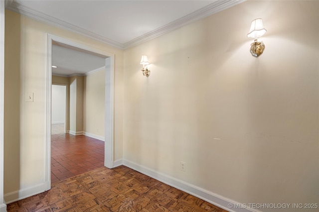 unfurnished room featuring baseboards and ornamental molding