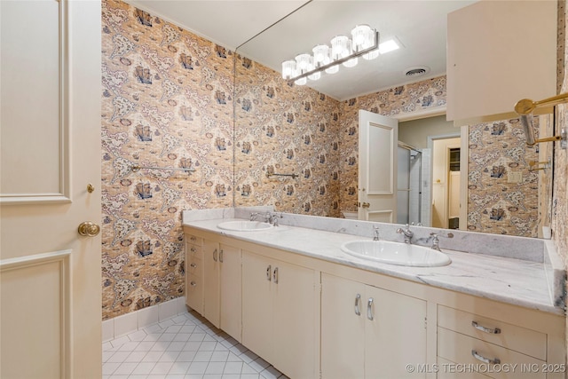 full bath with tile patterned flooring, visible vents, a sink, and double vanity